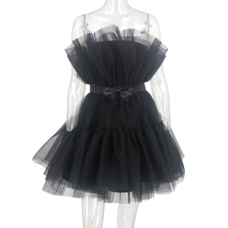 Black tulle dress on a mannequin against a white background